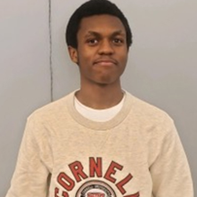 scholarship recipient wearing cornell university sweater